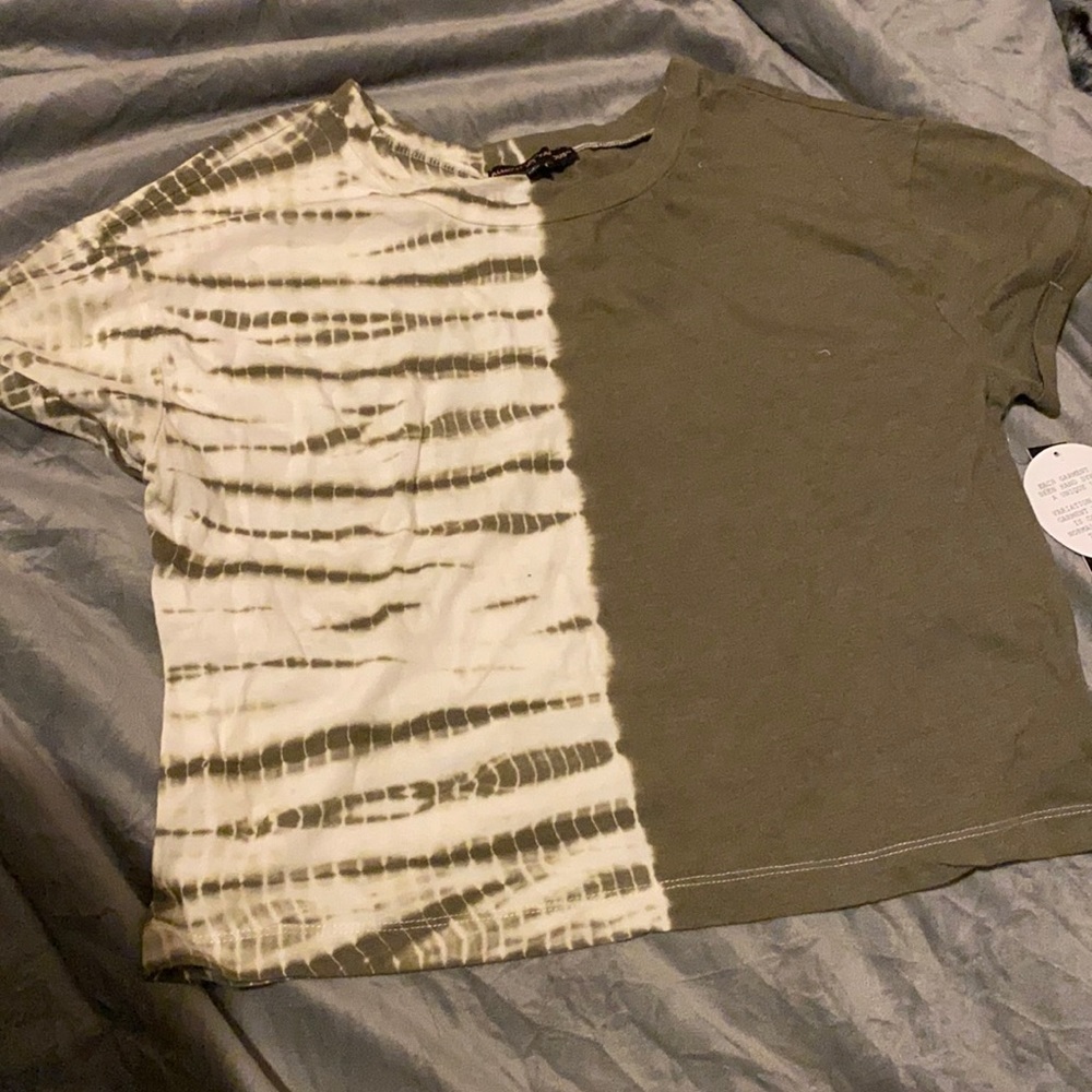 A green half & half shirt . Brand new with tags